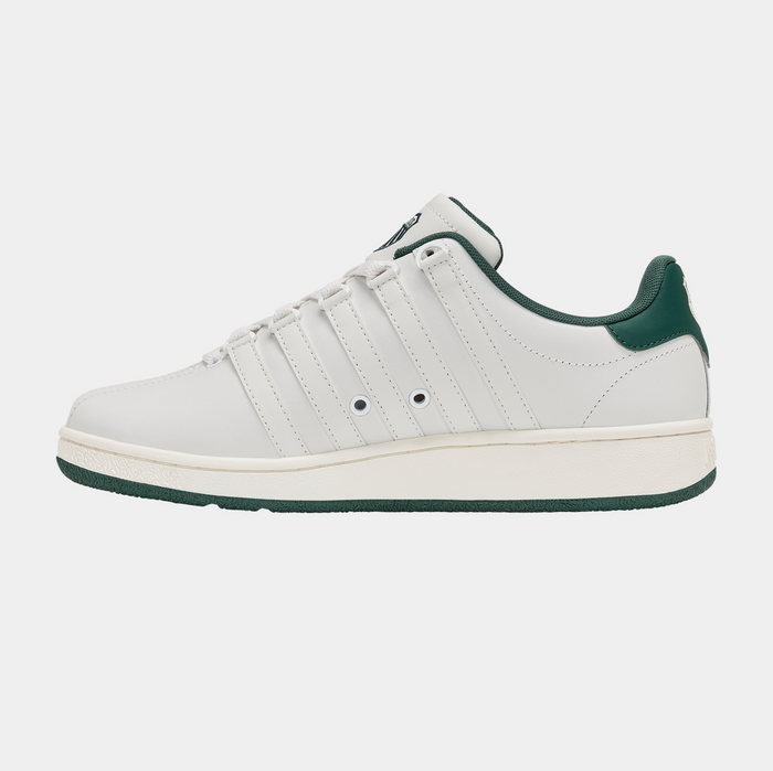 K-Swiss Classic VN sneakers in white leather with green accents, side view showing iconic striped overlays and padded collar.
