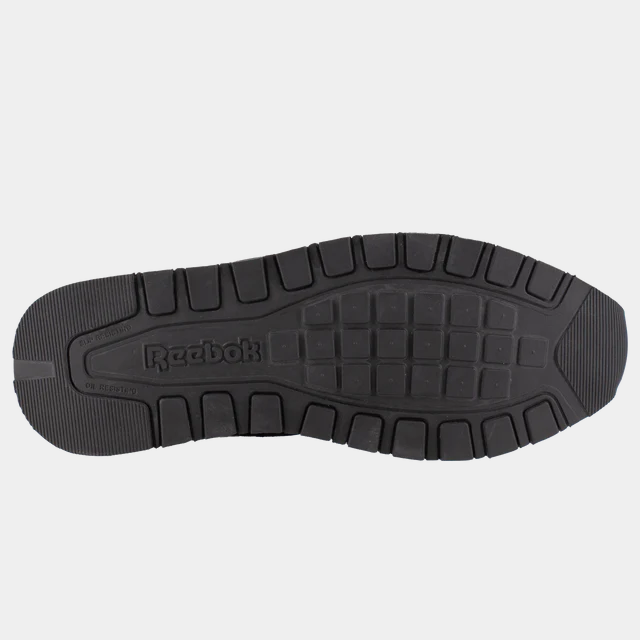 Reebok Work Classic Work Sneaker outsole in black rubber with slip-resistant tread pattern and Reebok logo, bottom view.