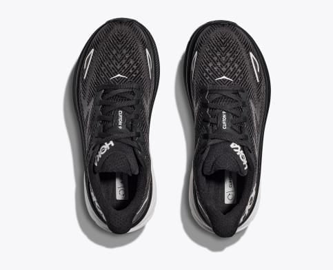 HOKA Clifton 9 running shoes in black with breathable mesh upper and lace-up closure, top view.