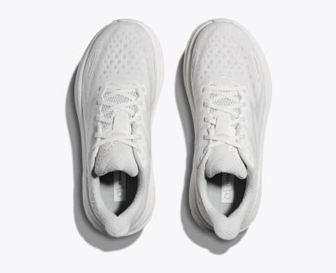 HOKA Clifton 9 running shoes in white with breathable mesh upper and lace-up closure, top view.