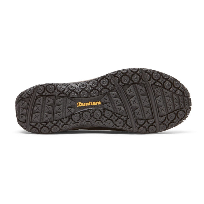 Dunham Cloud Plus Waterproof Slip-On shoe outsole in black with textured grip pattern and Dunham logo in yellow.