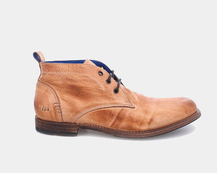 Bed Stu Clyde Chukka boots in distressed tan leather with clean stitching and layered sole, side view.