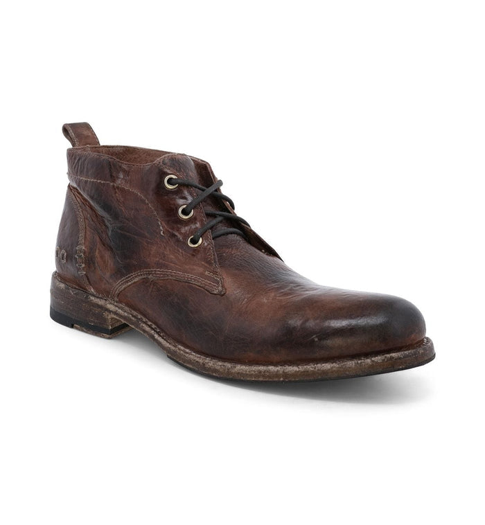 Bed Stu Clyde Chukka boots in distressed brown leather with lace-up closure and pull tab, angled front view.