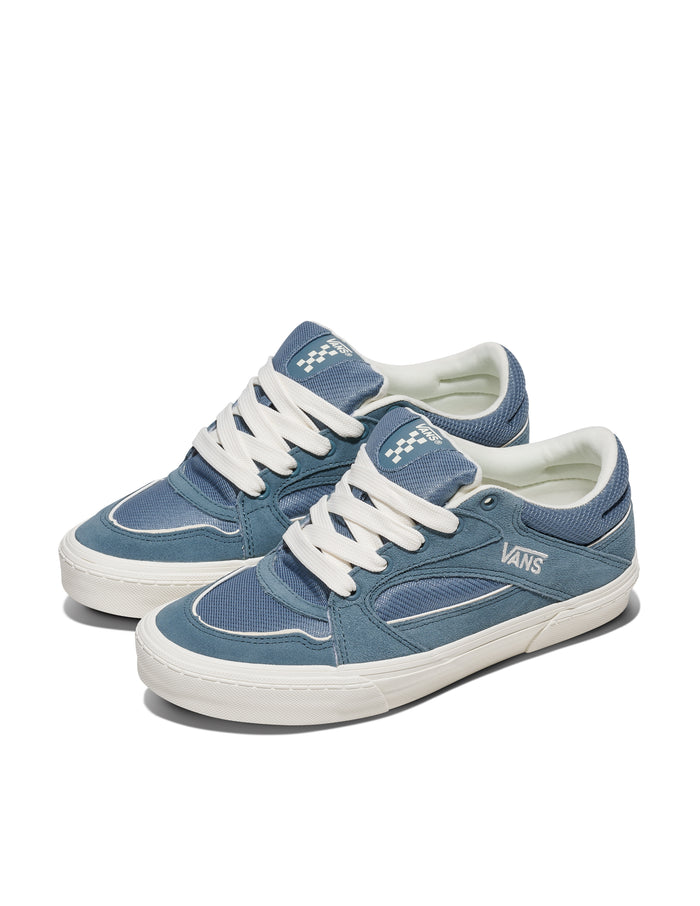 Vans Colson sneakers in blue with suede overlays, mesh panels, white laces, and rubber sole, angled front-side view.