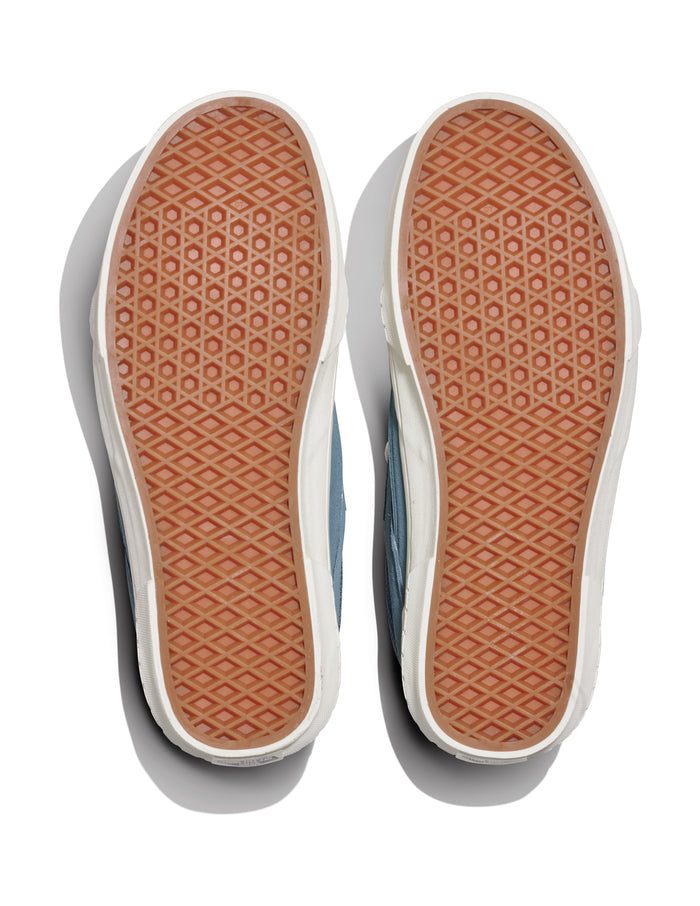 Vans Colson shoes outsole featuring waffle pattern design in gum rubber with white midsole, bottom view.