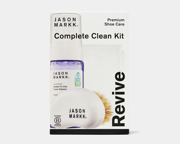 Jason Markk Complete Clean Kit for premium shoe care featuring ready-to-use foam cleaner bottle and soft bristle brush, front view.