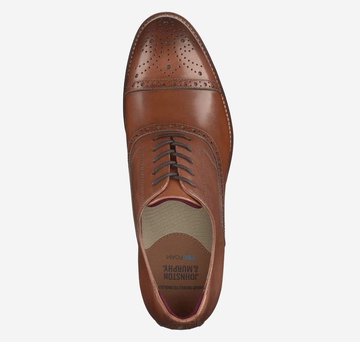 Johnston & Murphy Conard Cap Toe dress shoe in brown leather with brogue detailing and lace closure, top view.