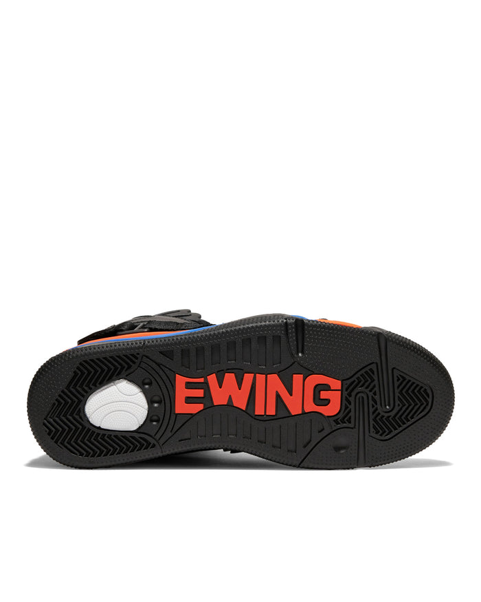 Ewing Athletics CONCEPT OG PE sneakers, black rubber outsole with bold red "Ewing" branding and grooved traction patterns, bottom view.