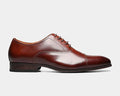Florsheim Corbetta dress shoe in polished brown leather with cap toe design and stacked heel, side view.