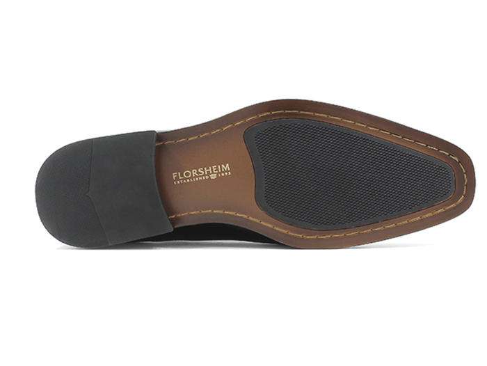 Florsheim Corbetta dress shoe outsole in brown and black with textured grip and stitched detailing, bottom view.