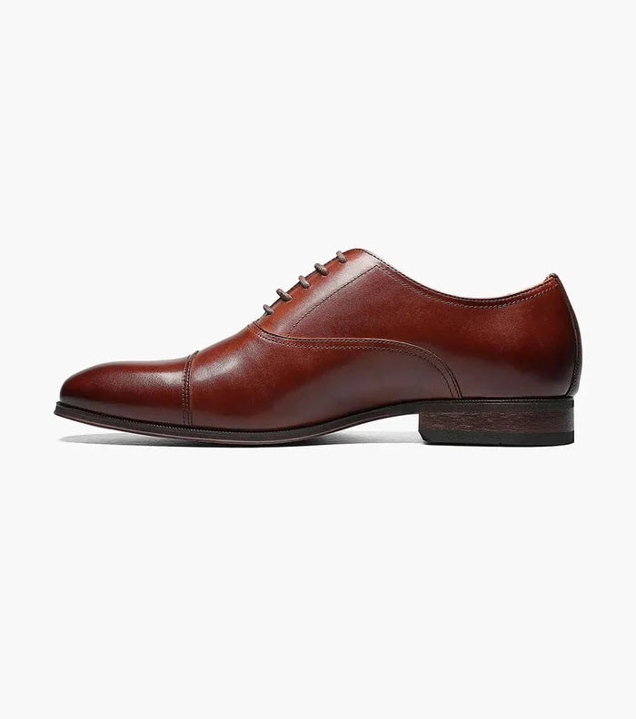 Florsheim Corbetta oxford dress shoes in rich brown leather with cap toe and stacked heel, side view.
