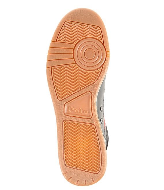 Polo Ralph Lauren Court Mid sneakers outsole featuring embossed branding and herringbone grooves in tan rubber, bottom view.