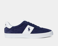 A navy and white striped suede sneaker with a white sole.