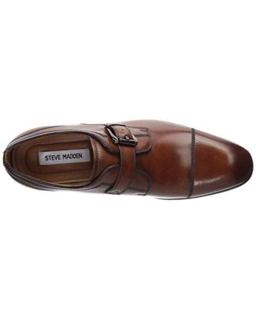 Steve Madden Covet dress shoe in brown leather with a monk strap and cap toe detailing, top view showing interior branding.