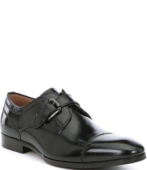 Steve Madden Covet dress shoe in black leather with monk strap and cap toe design, side angle view.