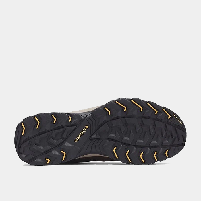 Columbia Crestwood Waterproof hiking shoe outsole in black with yellow accents, showing rugged tread for traction and grip.