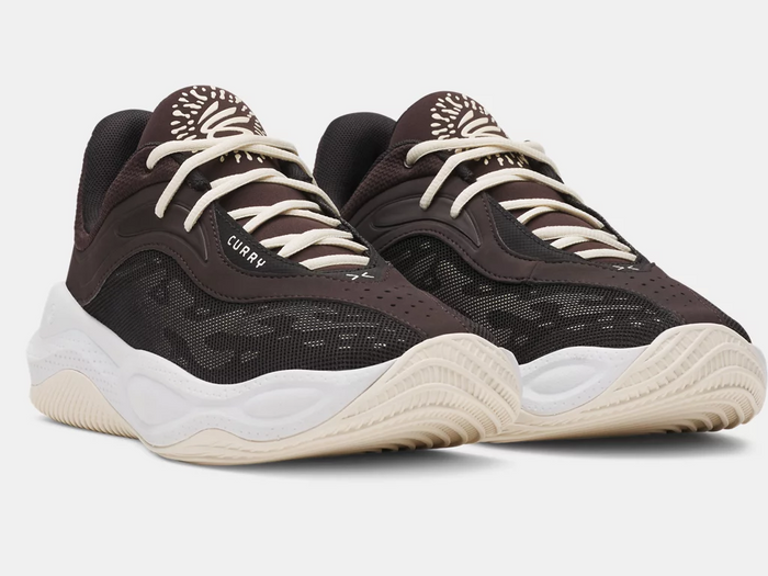 Under Armour Curry Splash 25 basketball shoes in dark brown with breathable mesh uppers, cream laces, and textured midsoles, front angle view.