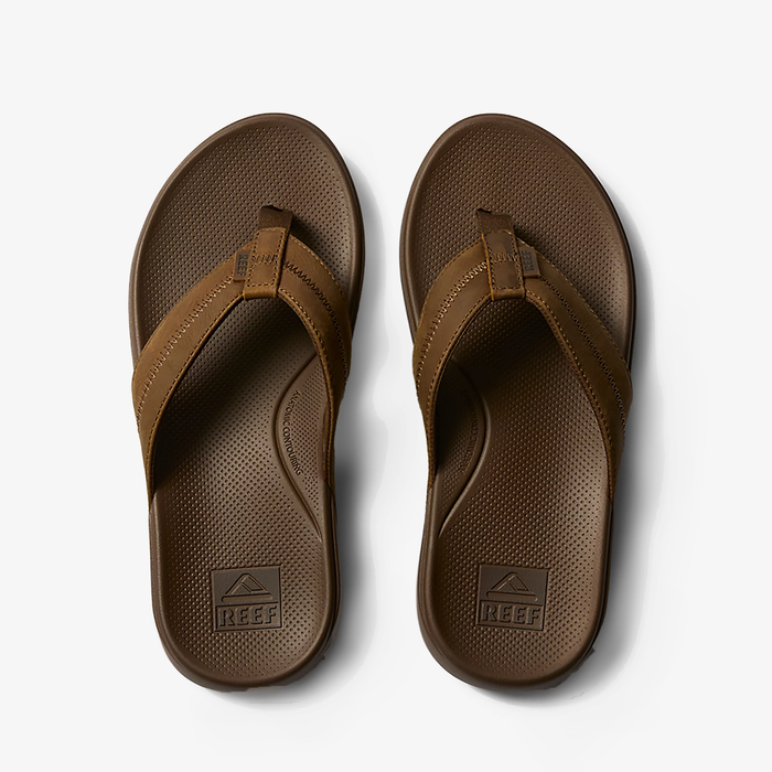 Reef Cushion Phantom 2.0 LE sandals in brown with leather straps and textured footbed, top view.