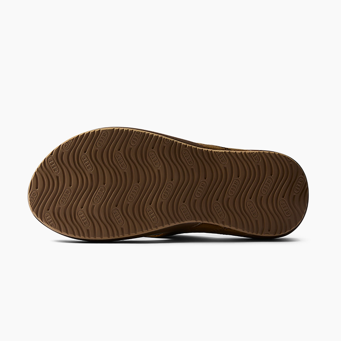 Reef Cushion Phantom 2.0 LE sandals outsole in brown rubber with textured wave pattern and Reef logo detailing.