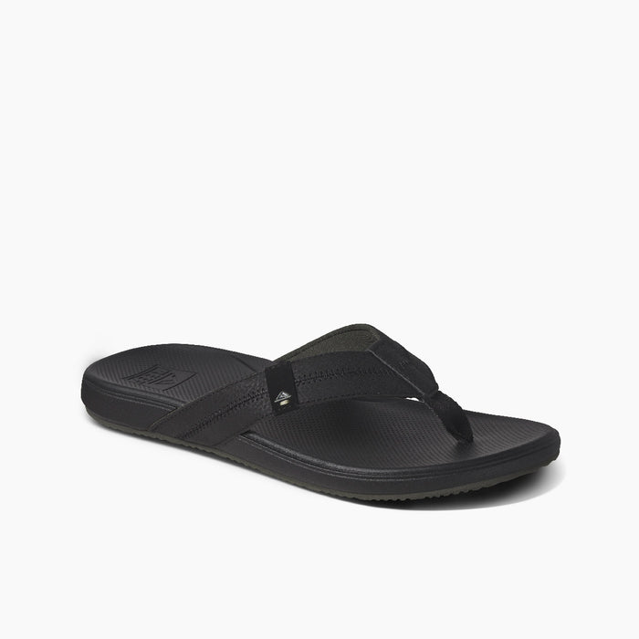 Reef Cushion Phantom 2.0 sandals in black with soft padded straps, cushioned footbed, and textured outsole, angled side view.