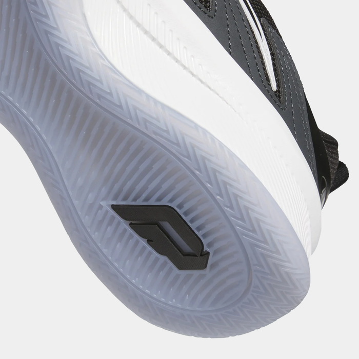 Adidas Dame Certified 3 basketball shoes with translucent outsole featuring herringbone traction pattern and logo detail, sole view.