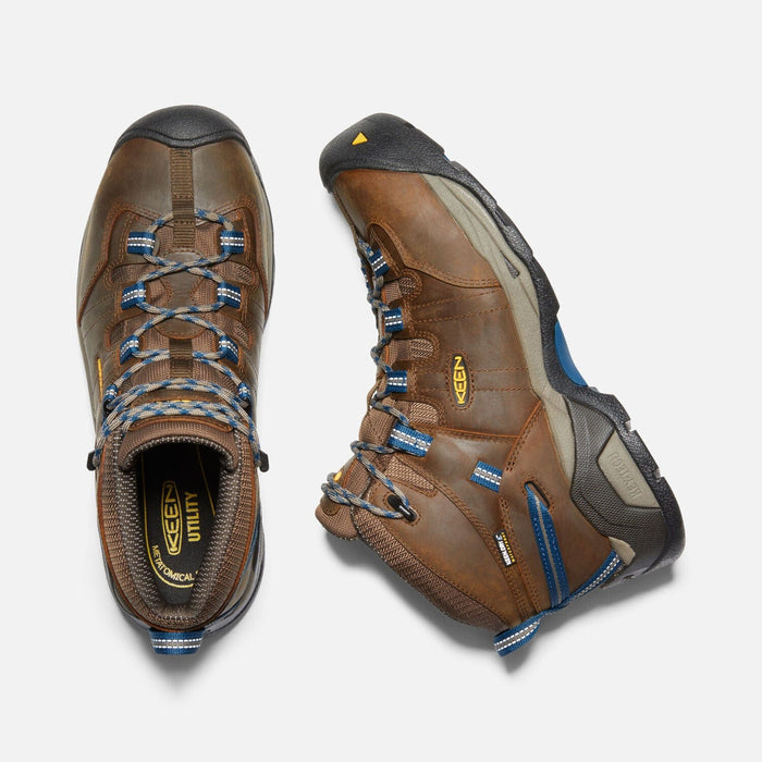 Keen Detroit XT Steel Toe Mid Waterproof Boots with brown leather, blue accents, steel toe protection, and rugged outsole, top view.