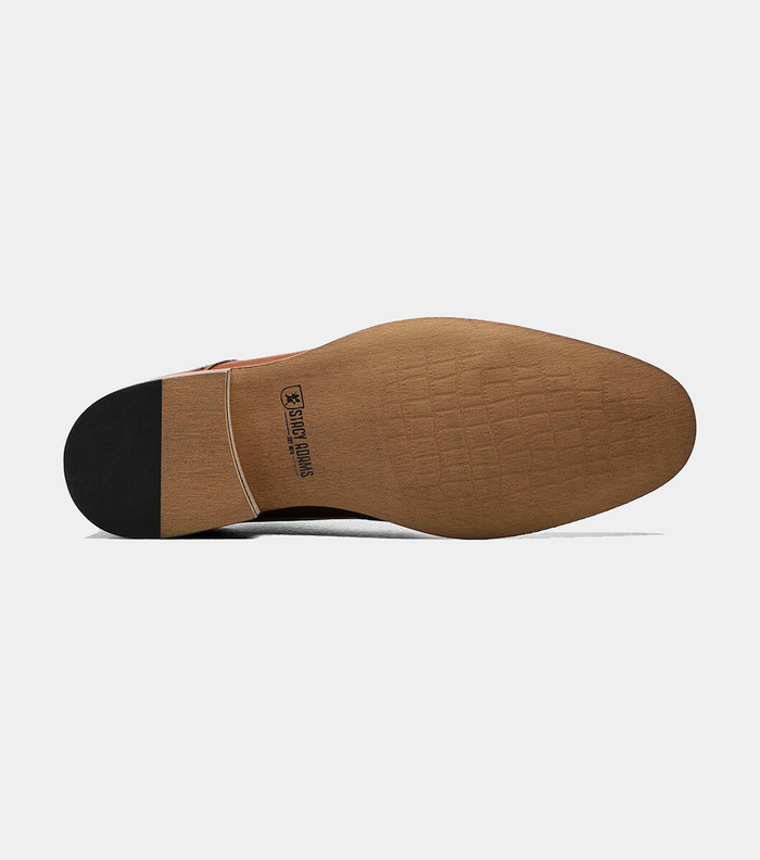 Stacy Adams Dickinson Cap Toe dress shoe outsole in light brown with textured grips and branding, bottom view.