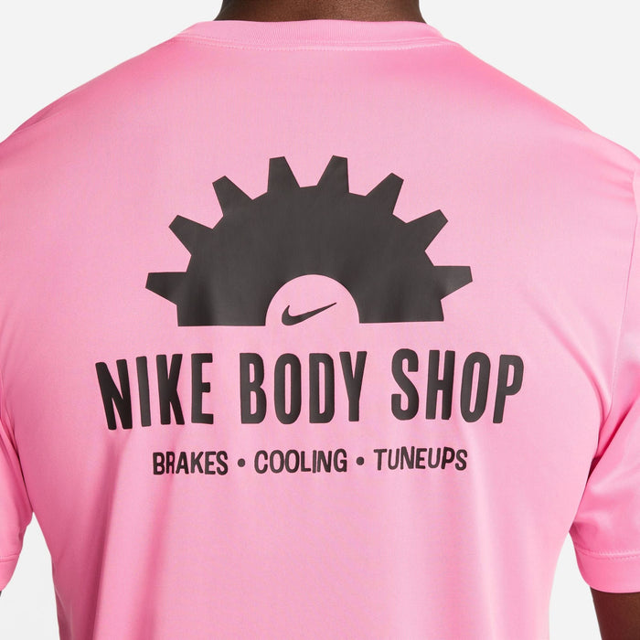 Nike Dri-FIT Fitness T-Shirt in pink with "Nike Body Shop" graphic and text details in black, back view.