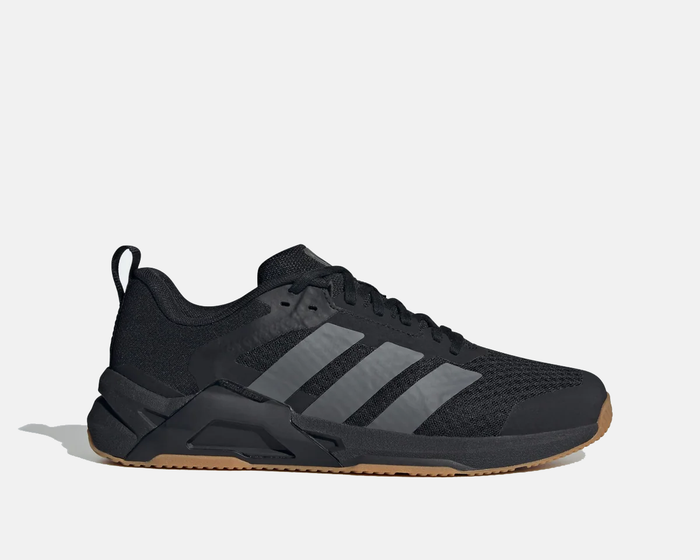 Adidas Dropset Control Trainer shoes in black with gray stripes, mesh upper, and gum outsole, side view.