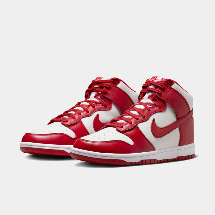 Nike Dunk High Retro SE sneakers in red and white with leather upper, perforated toe box, and red laces, front angle view.