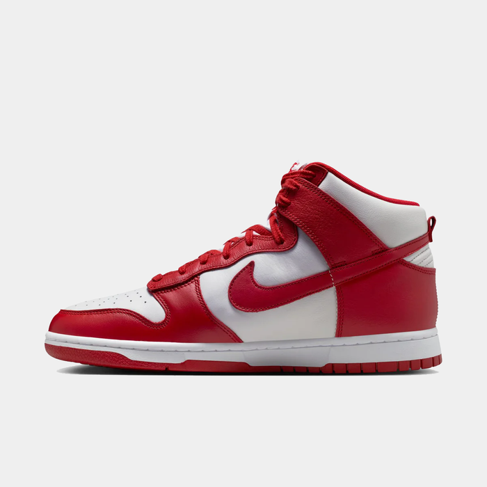 Nike Dunk High Retro SE sneakers in red and white leather with perforated toe box, Swoosh logo, and padded collar, side view.