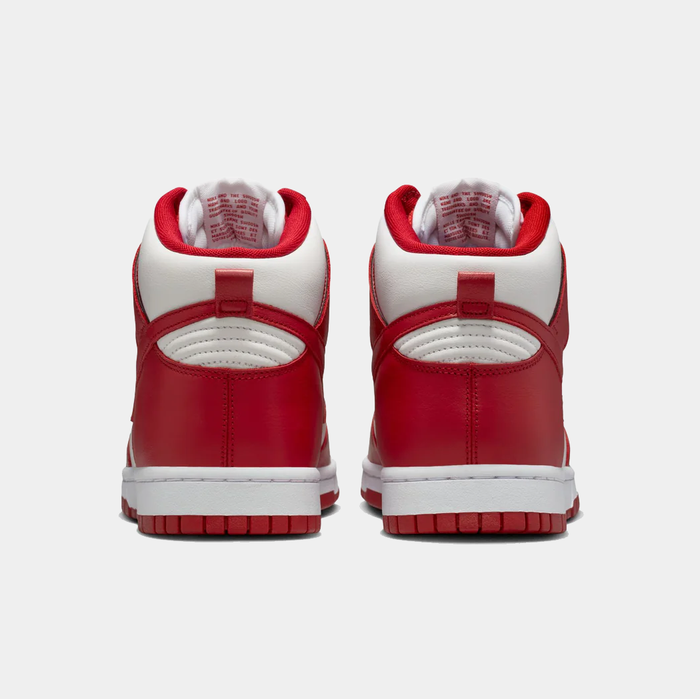 Nike Dunk High Retro SE sneakers in red and white with padded collar and textured leather, back view.
