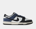 Nike Dunk Low Retro sneakers in black, white, and navy with stitched details and perforated toe box, side profile view.