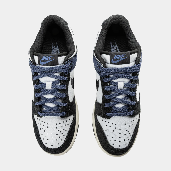 Nike Dunk Low Retro sneakers with white perforated toe box, black overlays, and blue textured laces, top view.