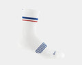 Darn Tough Element Micro Crew Lightweight Running Sock in white with red and blue stripes and ribbed cuff, side view.