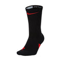 Nike Elite Crew socks in black with red Swoosh logo and reinforced cushioning, side view showing ribbed fabric and arch support.