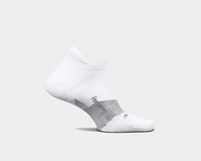 Feetures Elite Golf Max Cushion No Show Tab socks, white with gray accents, side view showing arch support and ribbed cuff.