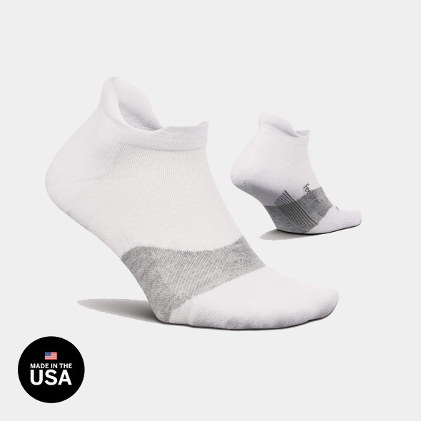 Feetures Elite Golf Max Cushion No Show Tab socks in white and gray with cushioned support, side view.