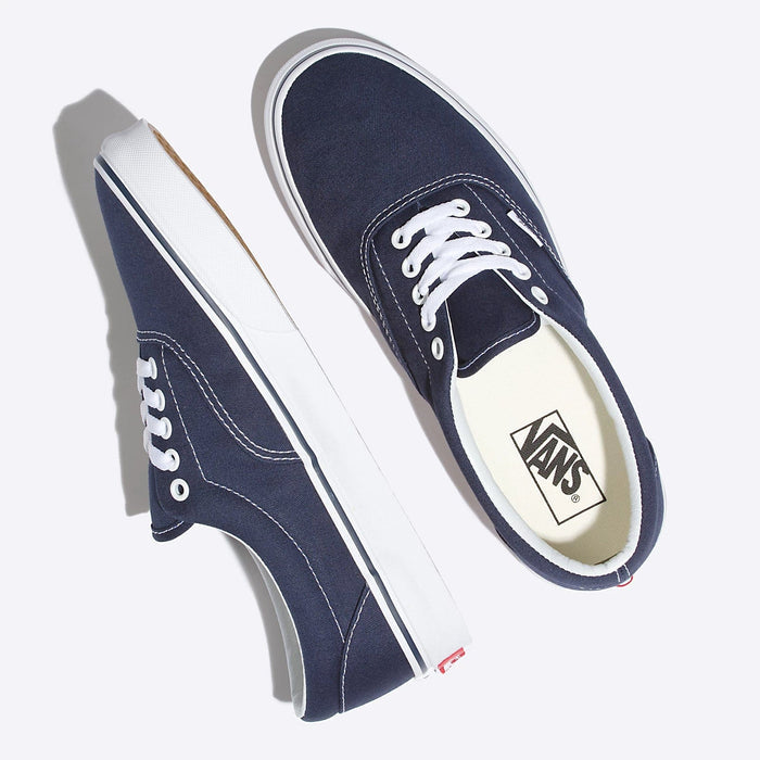 Vans Era Core shoes in navy blue canvas with white stitching, laces, and rubber sole, top and side view.