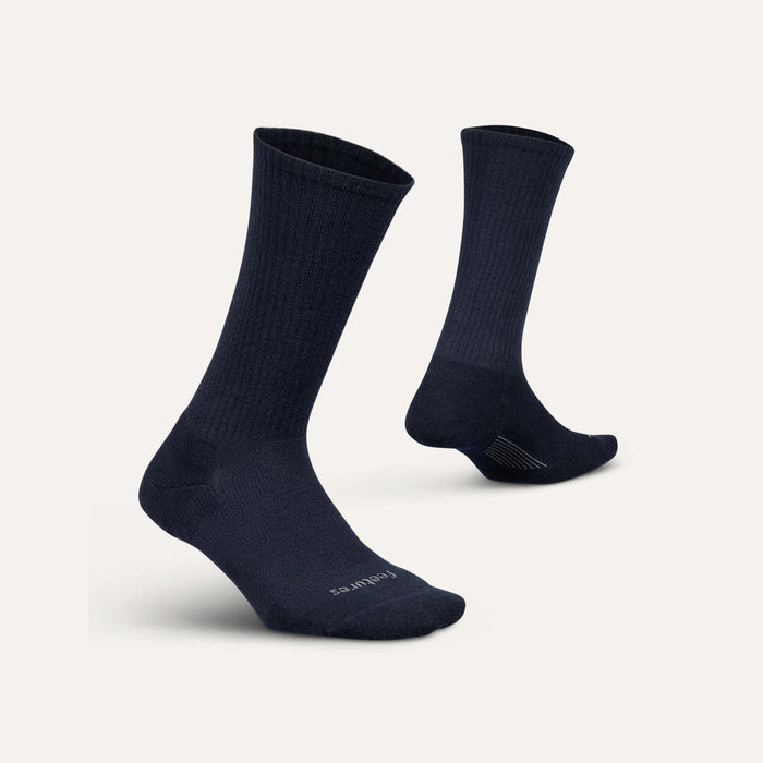 Feetures Everyday Max Cushion Crew socks in dark navy blue with ribbed texture and reinforced cushioning, angled view.