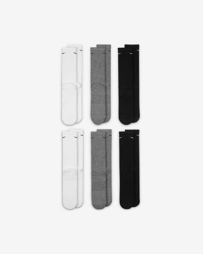 Nike Everyday Plus Cushioned Training Crew Socks in white, gray, and black, ribbed texture with reinforced cushioning, top view.
