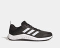 Adidas Everyset Trainer shoes in black with white accents, featuring mesh upper, cushioned midsole, and dual-density outsole, side view.