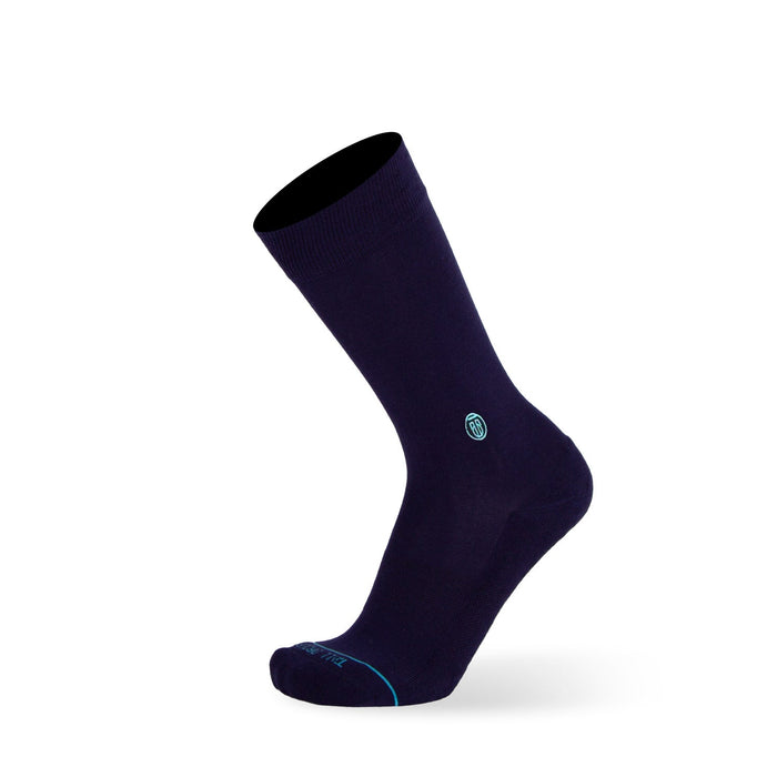 Tall Order Extra Cushioned Dress Socks in dark navy with ribbed cuff, reinforced toe, and light blue logo accents, side view.