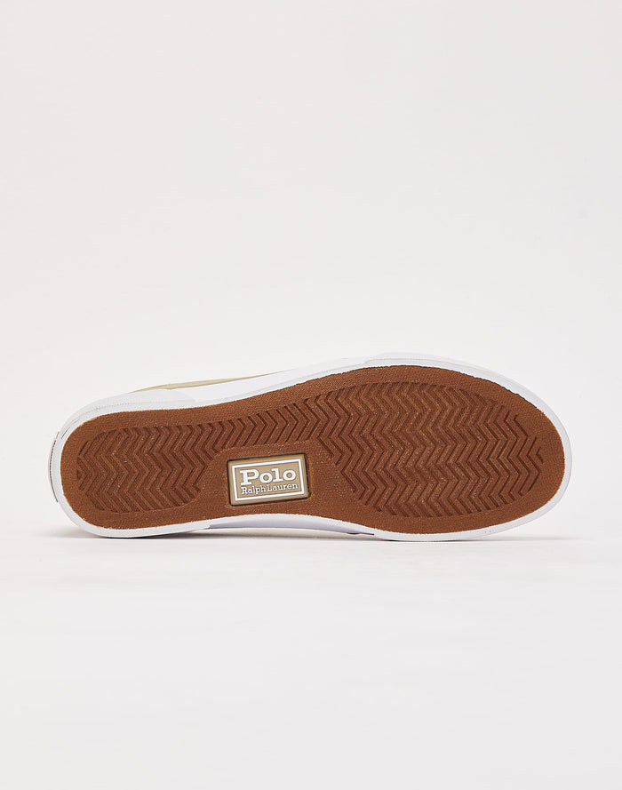 Polo Ralph Lauren Faxon X Canvas sneakers featuring a brown rubber outsole with herringbone tread pattern and logo detail, sole/bottom view.