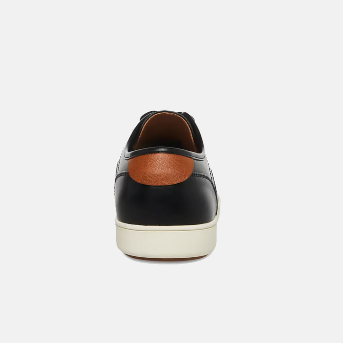 Steve Madden Fenta Leather shoes back view in black leather with contrasting tan heel accent and white sole.