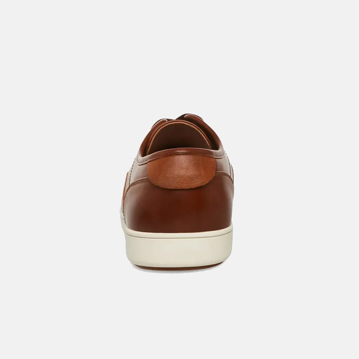 Steve Madden Fenta Leather sneakers in brown leather with contrast white sole, back view showing heel and stitching details.