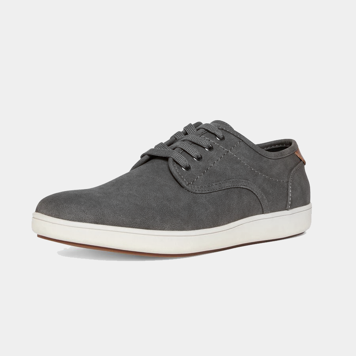 "Steve Madden Fenta Suede shoes in gray with a low-profile design, lace-up closure, and white rubber sole, angled front-side view"
