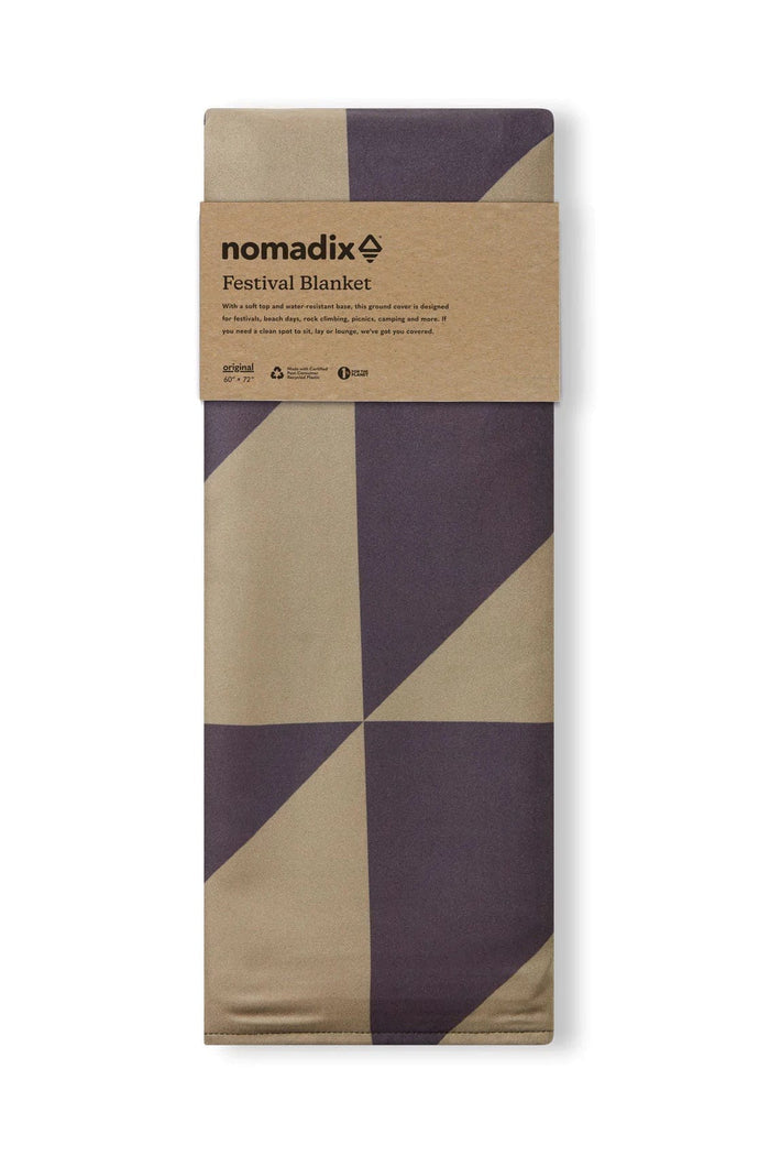 Nomadix Festival Blanket with geometric pattern in beige and dark purple, water-resistant and compact design, folded front view.
