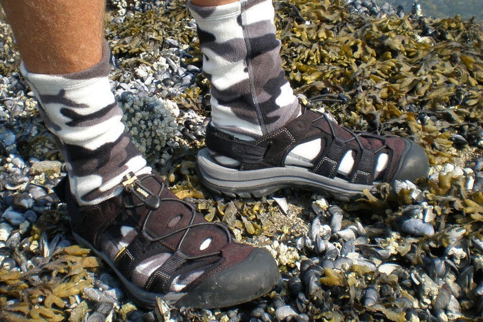 Polar Feet Fleece Socks in black-and-white camouflage pattern, worn outdoors for warmth and comfort.