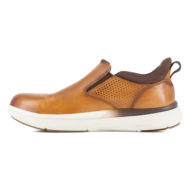 Florsheim Work Fleet Work Comp Toe Slip On shoes in tan leather with perforated sides, elastic goring, and white sole, side view.